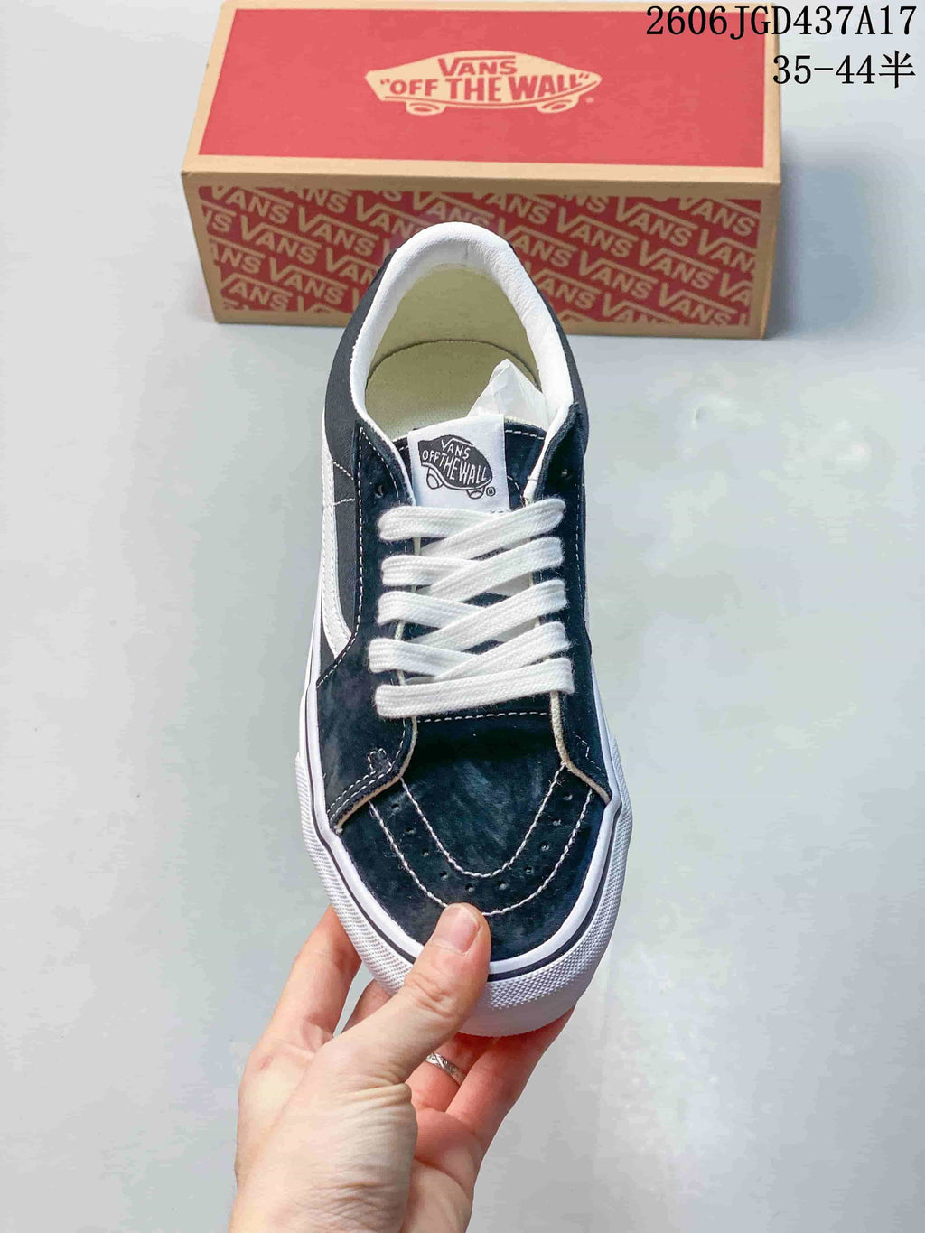 Top view of the sneaker showing its laces and stitched toe overlays
