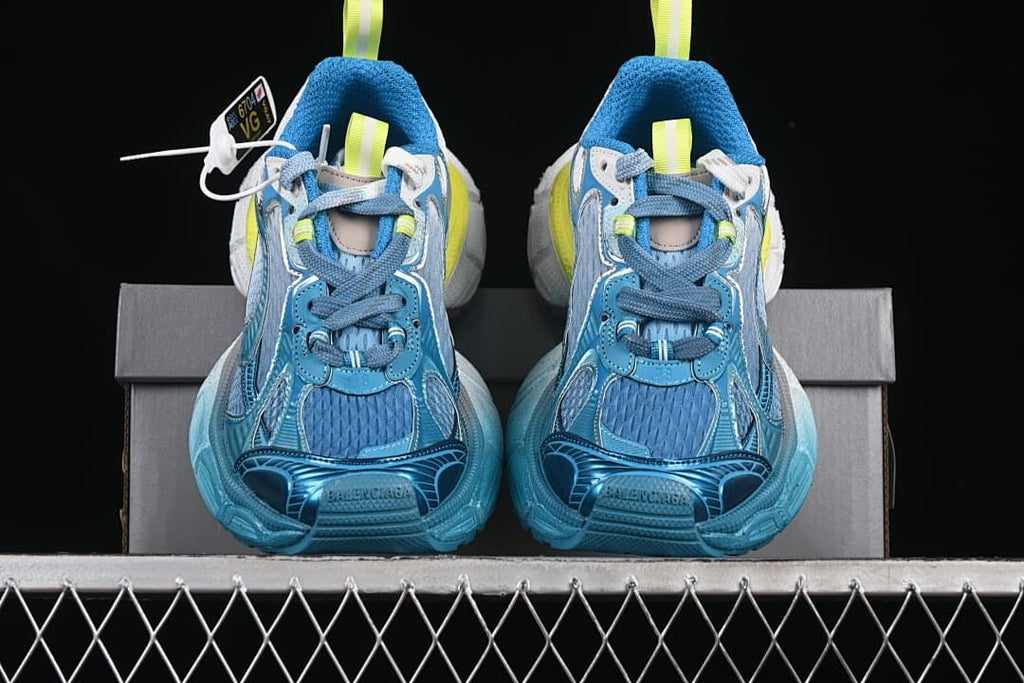 Front view of the pair showing blue uppers and contrasting accents