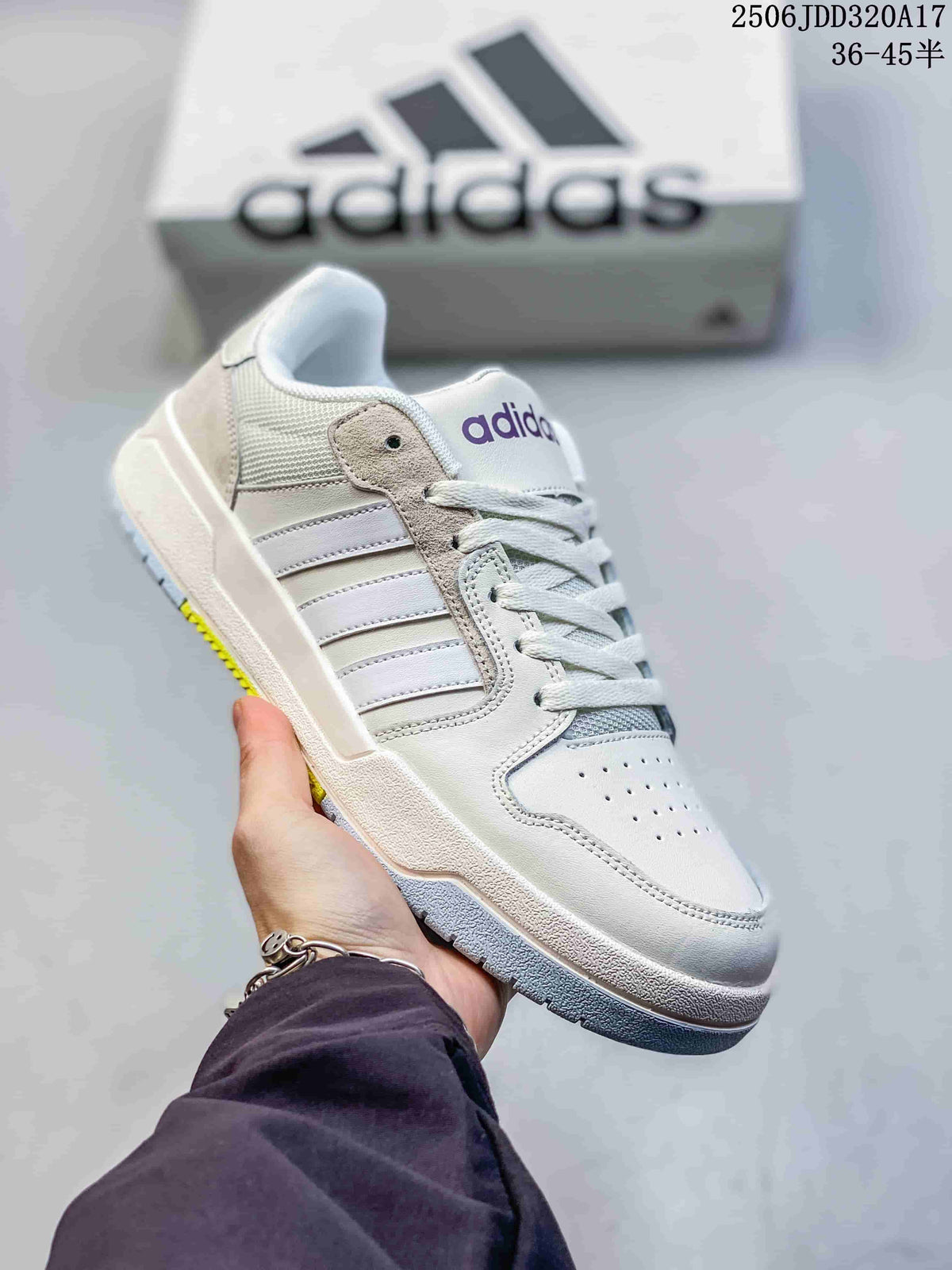 White adidas Entrap sneaker with pale neutral side stripes and a gum-accented outsole