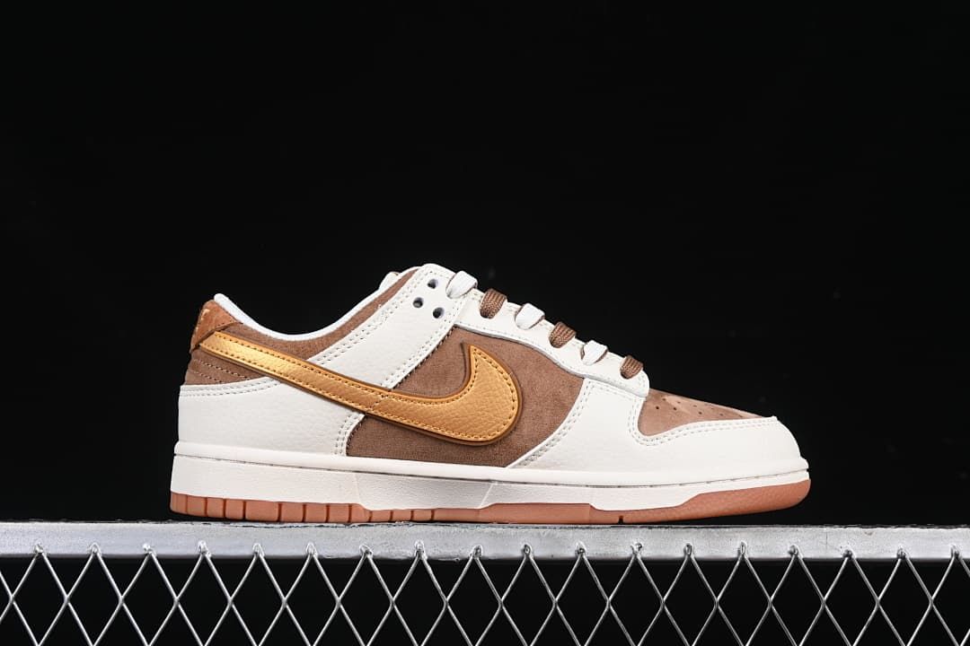 Side profile of the low-top sneaker in off-white, brown, and golden yellow