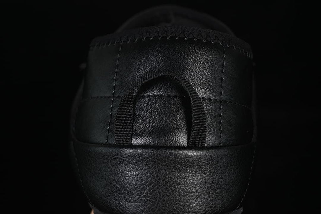 Rear view showing the heel panel and pull loop.