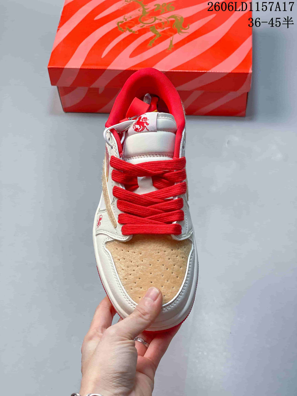 Top view showing red laces and perforated tan toe panel
