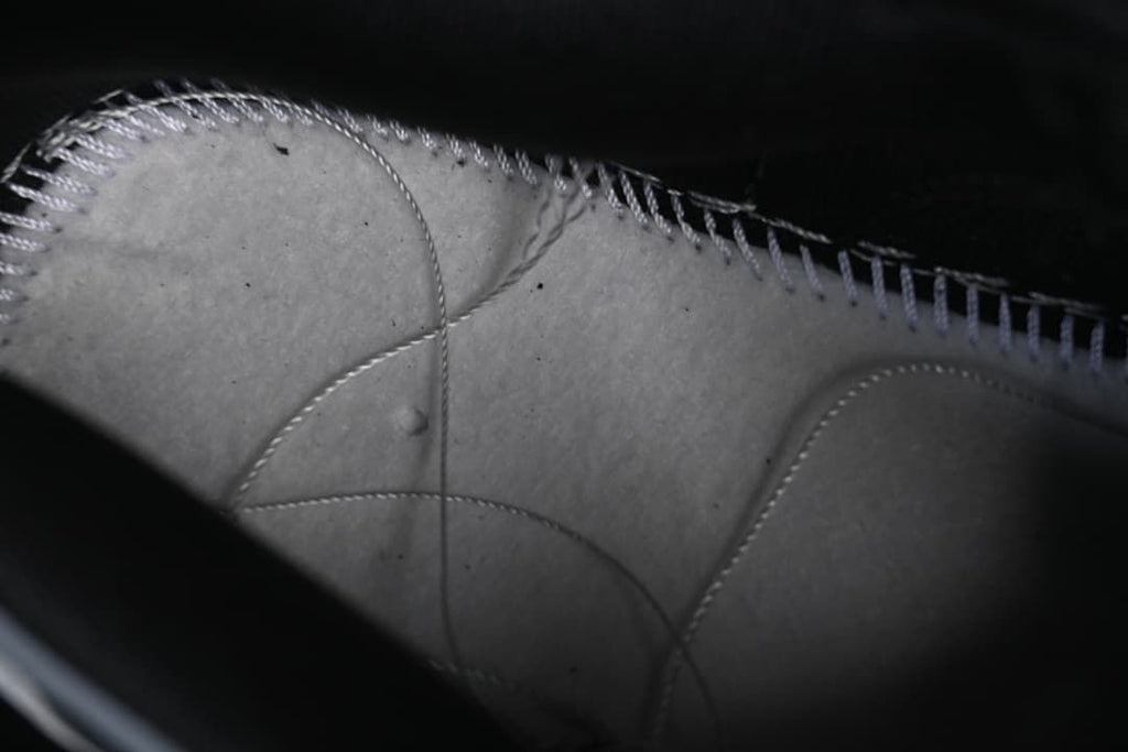 Close-up view of the sneaker's interior stitching and panels