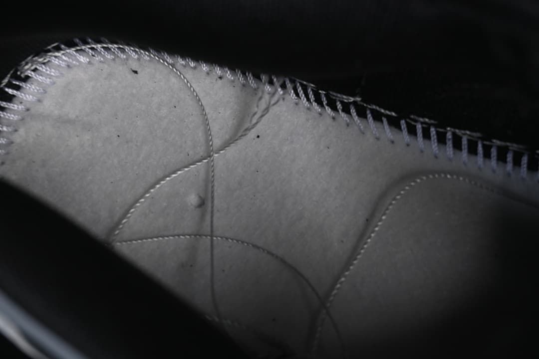 Close-up view of the sneaker's interior stitching and panels