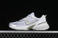 Nike V2K Run sneaker in white, silver, and gray-green, side view