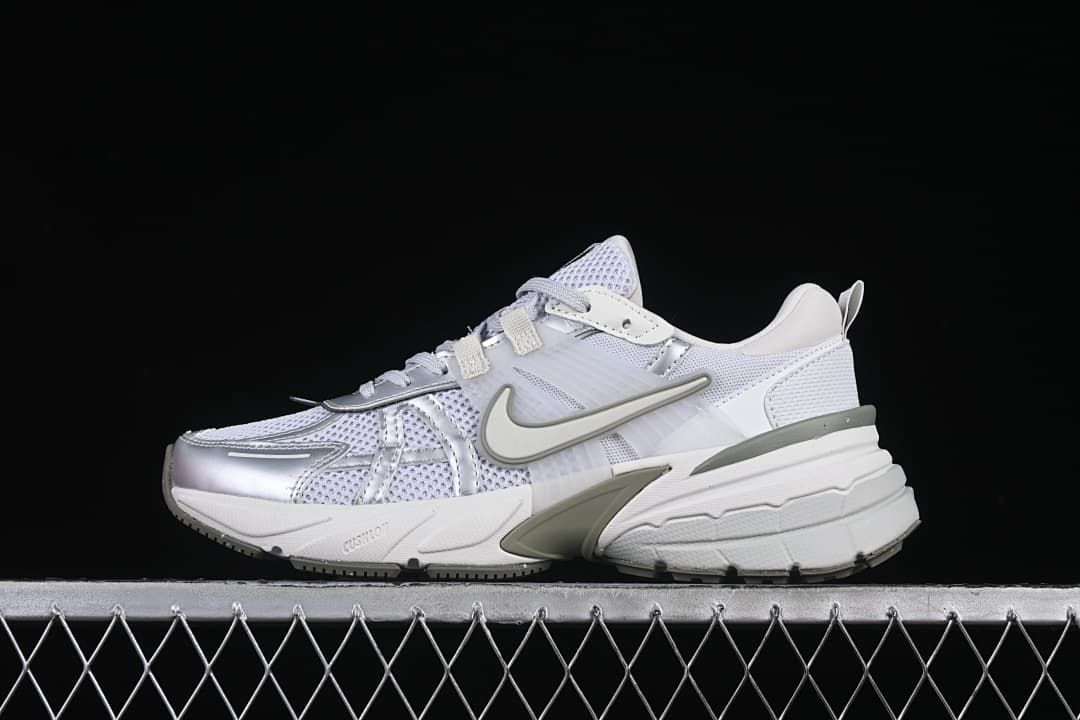 Nike V2K Run sneaker in white, silver, and gray-green, side view