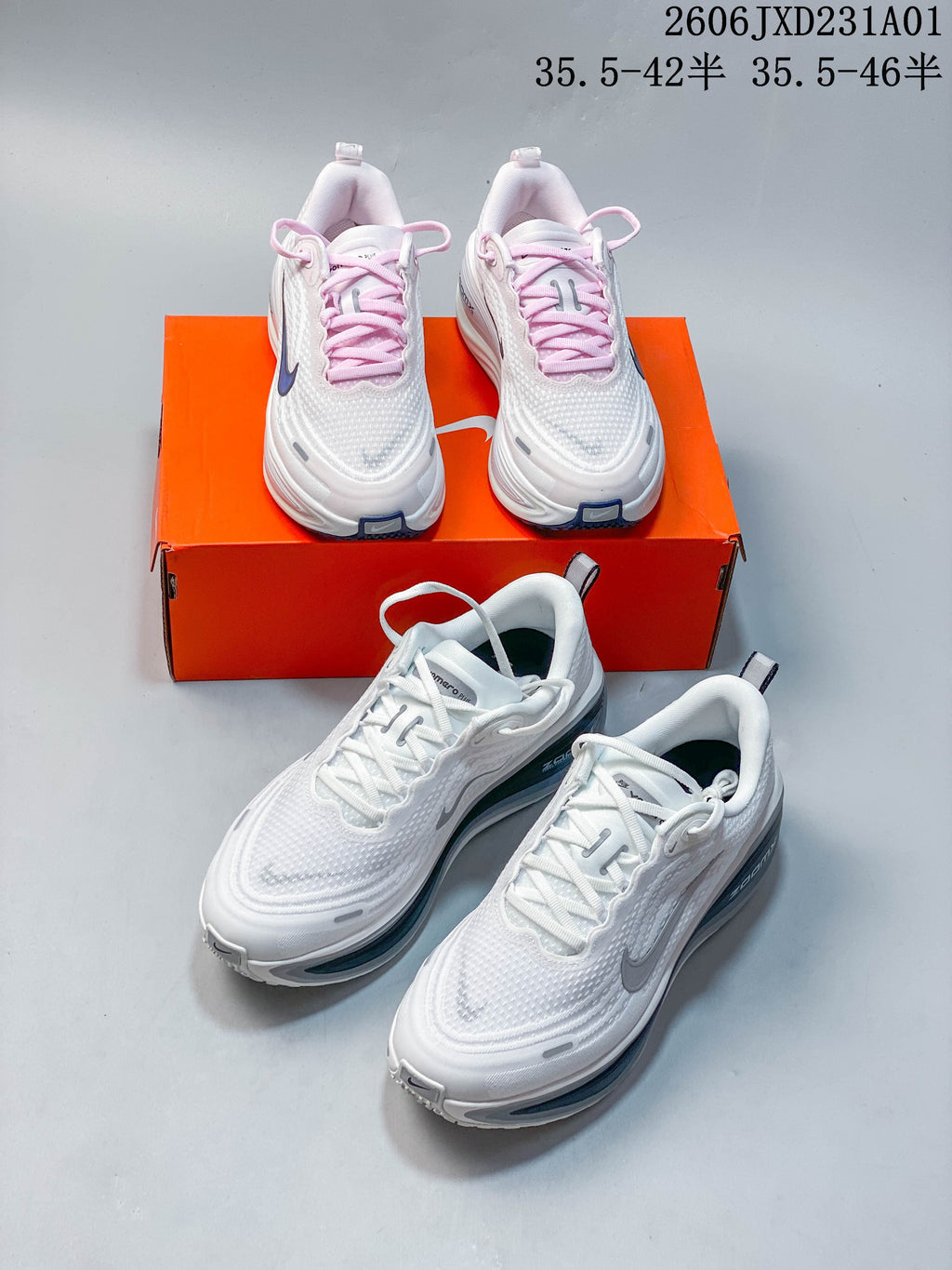 White Nike Vomero Plus shoes shown in pale pink-lace and white-lace variations.