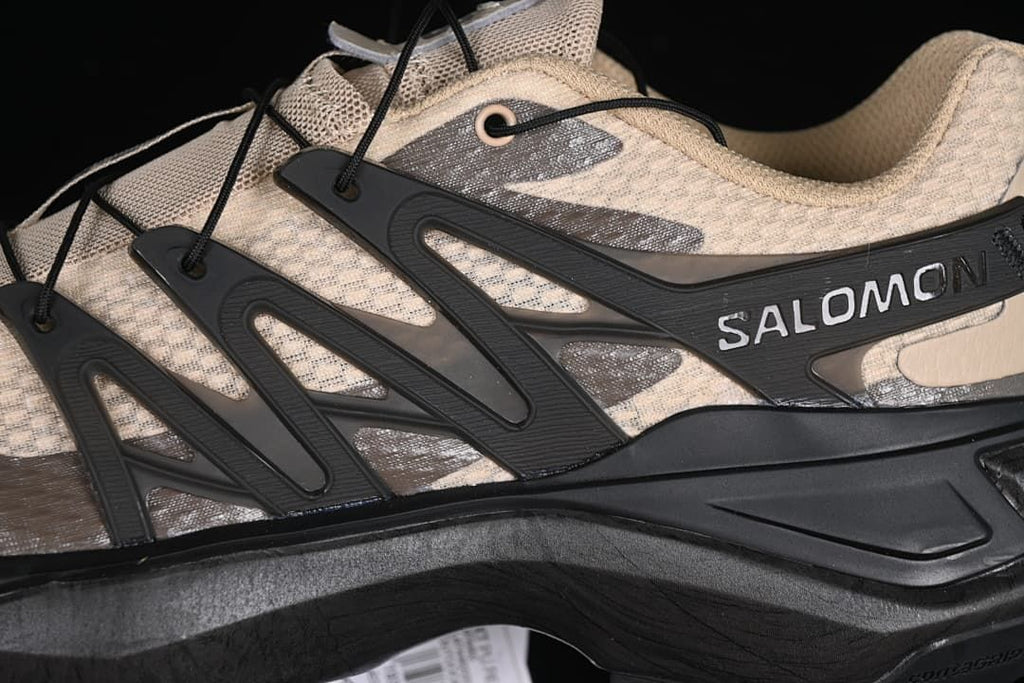 Close-up of the side cage, cord lacing, and Salomon branding