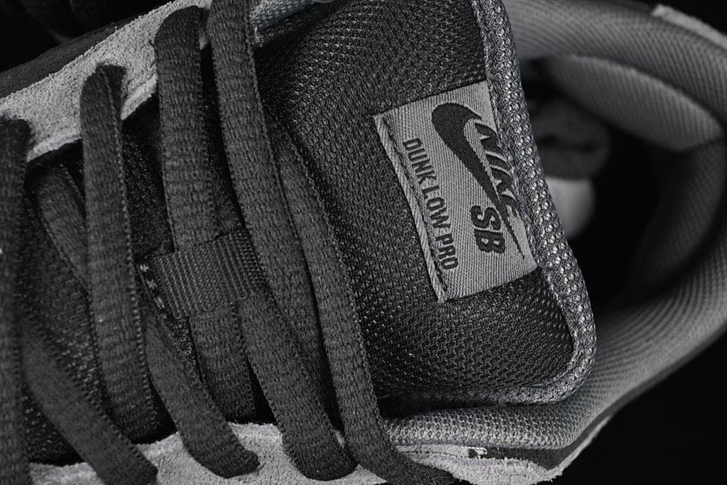 Close-up of the Nike SB Dunk Low Pro tongue label and black laces
