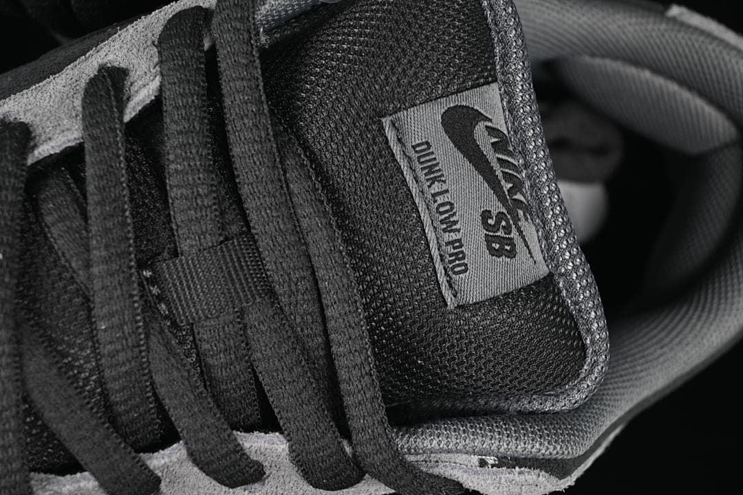 Close-up of the Nike SB Dunk Low Pro tongue label and black laces
