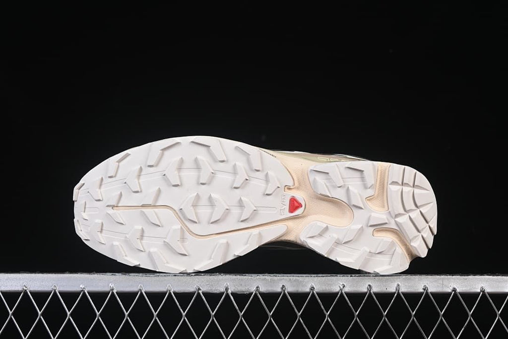 Underside view of the shoe showing the lugged outsole.