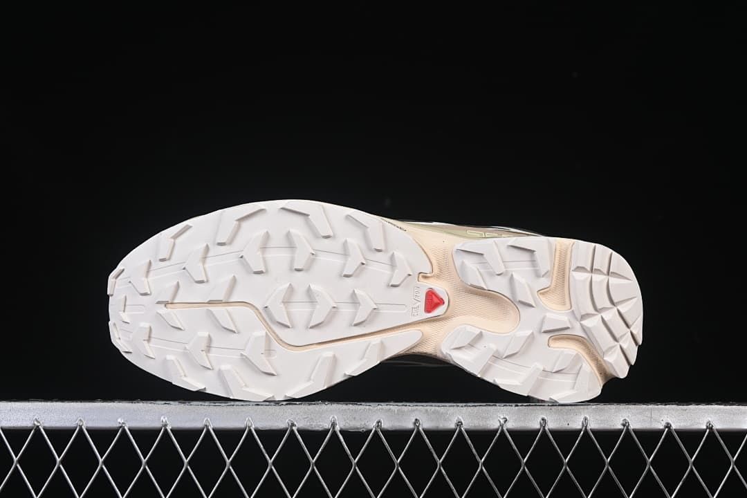 Underside view of the shoe showing the lugged outsole.