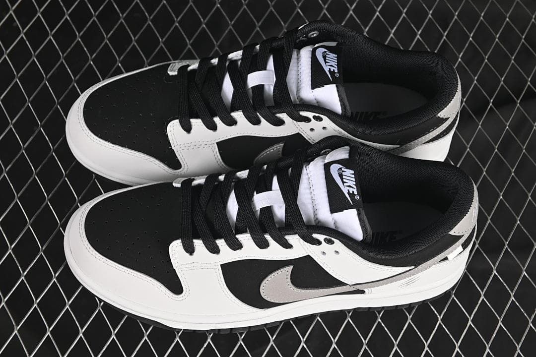 Pair of black, white, and grey low-top sneakers viewed from above