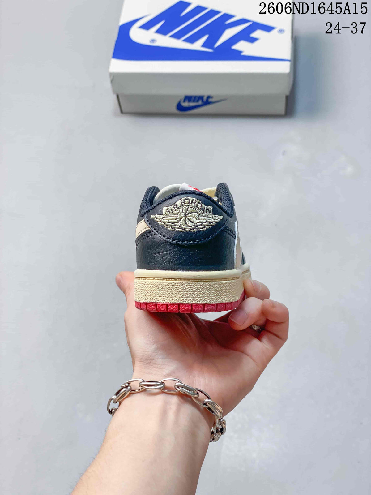 Rear view showing cream embroidered wing-style detail and red outsole