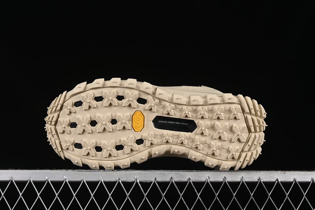 Underside of the sneaker showing its patterned outsole and Vibram mark.