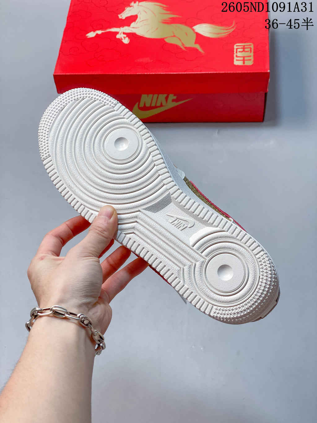 Close-up of the white circular-patterned outsole.