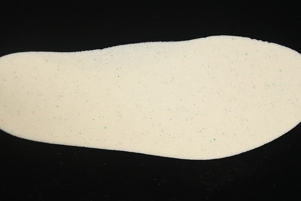 Light-colored shoe insole viewed separately