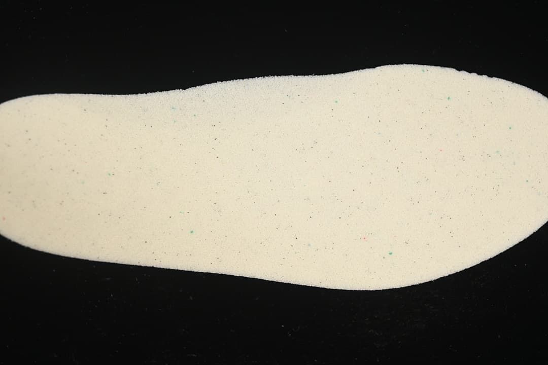 Light-colored shoe insole viewed separately