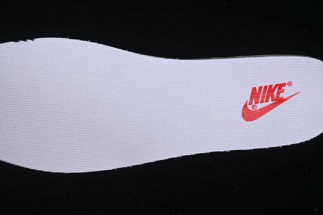 White shoe insert with a red Nike logo