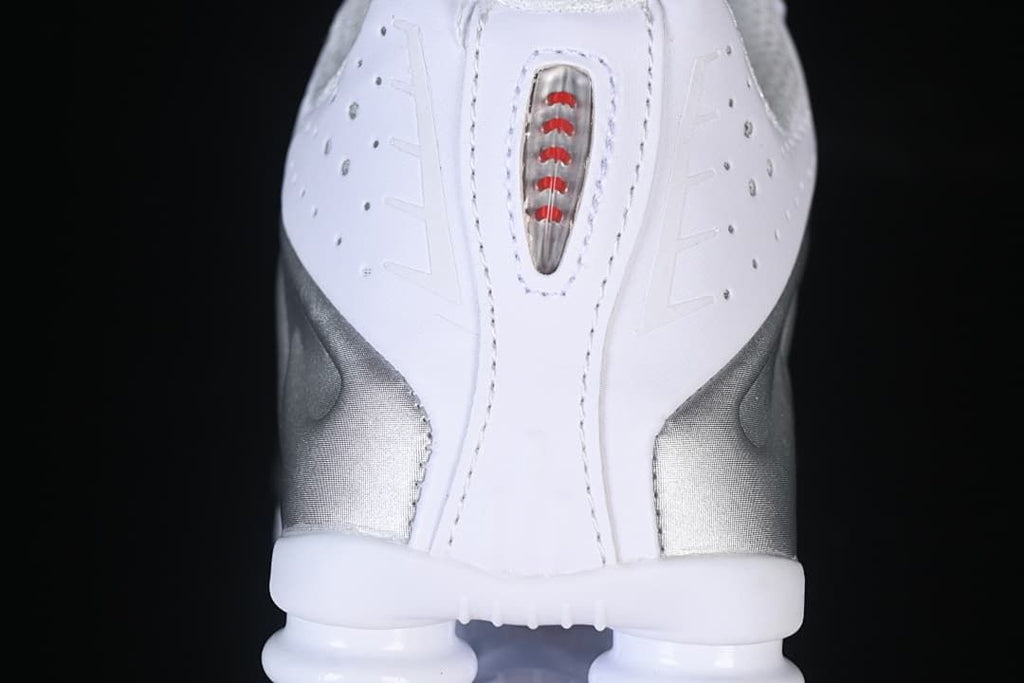 Rear view showing the Shox heel columns and red detail