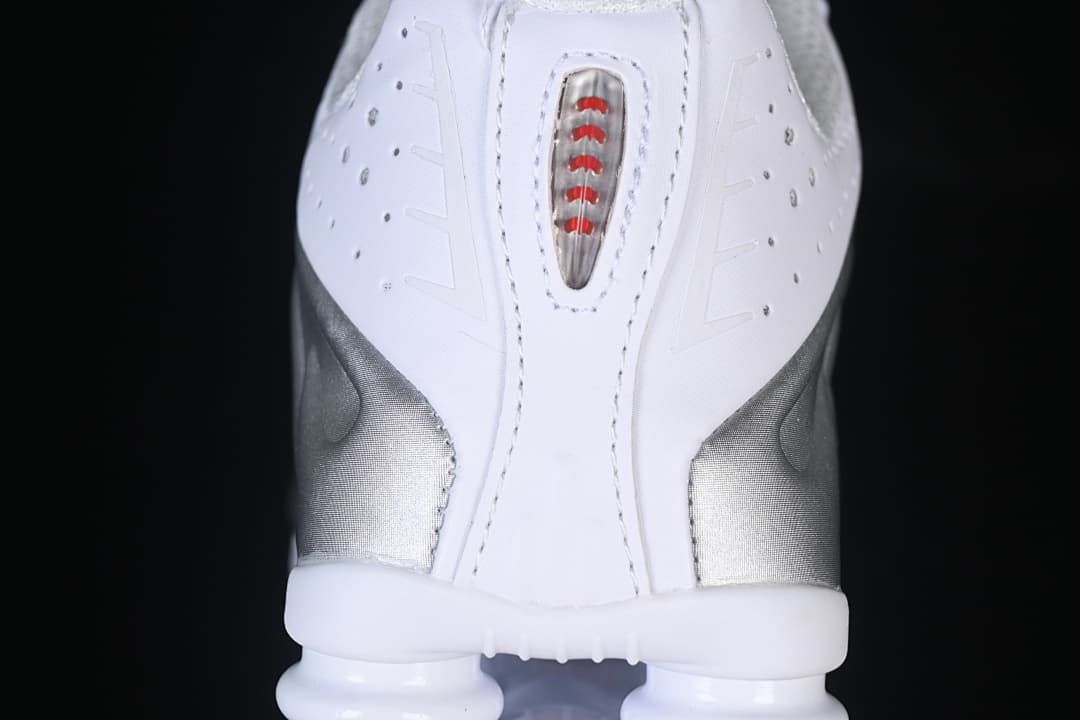 Rear view showing the Shox heel columns and red detail