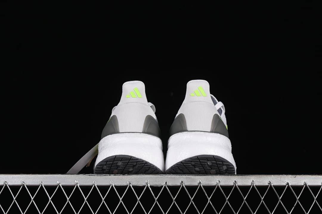 Rear view of the pair showing heel details and outsoles.