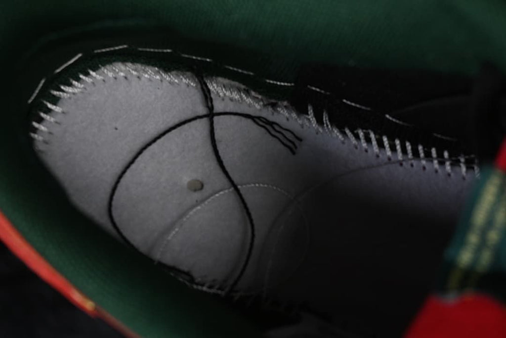 Interior close-up showing stitching and construction beneath the shoe’s lining.