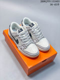 Pair of white and grey low-top sneakers with patterned side panels and dark Swooshes on an orange box