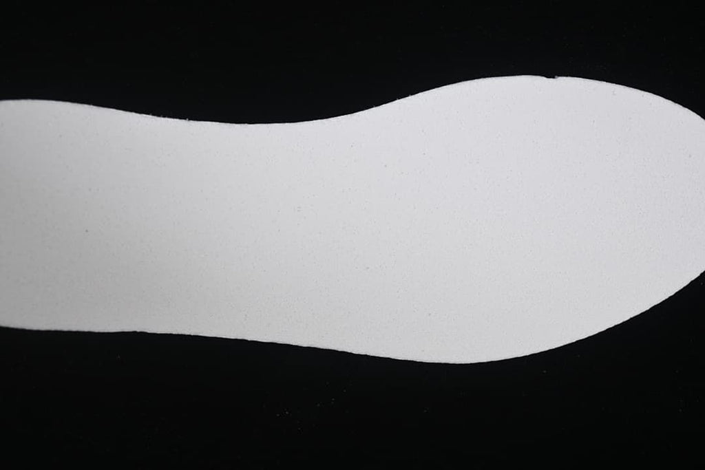 Close view of a plain white shoe insert
