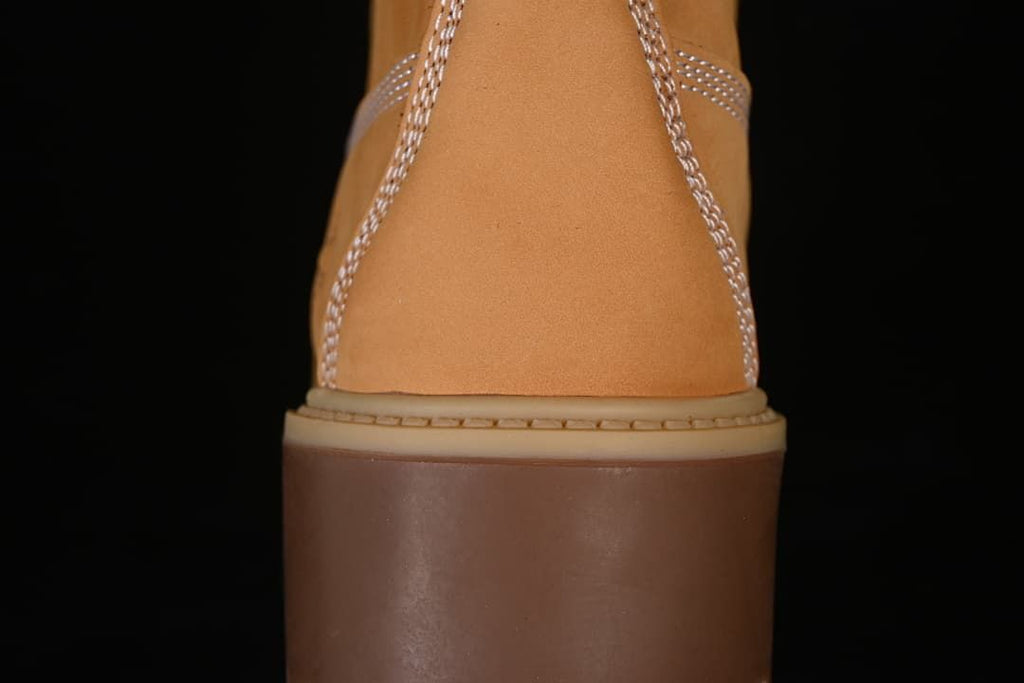 Rear view showing the boot's stitched heel and thick sole