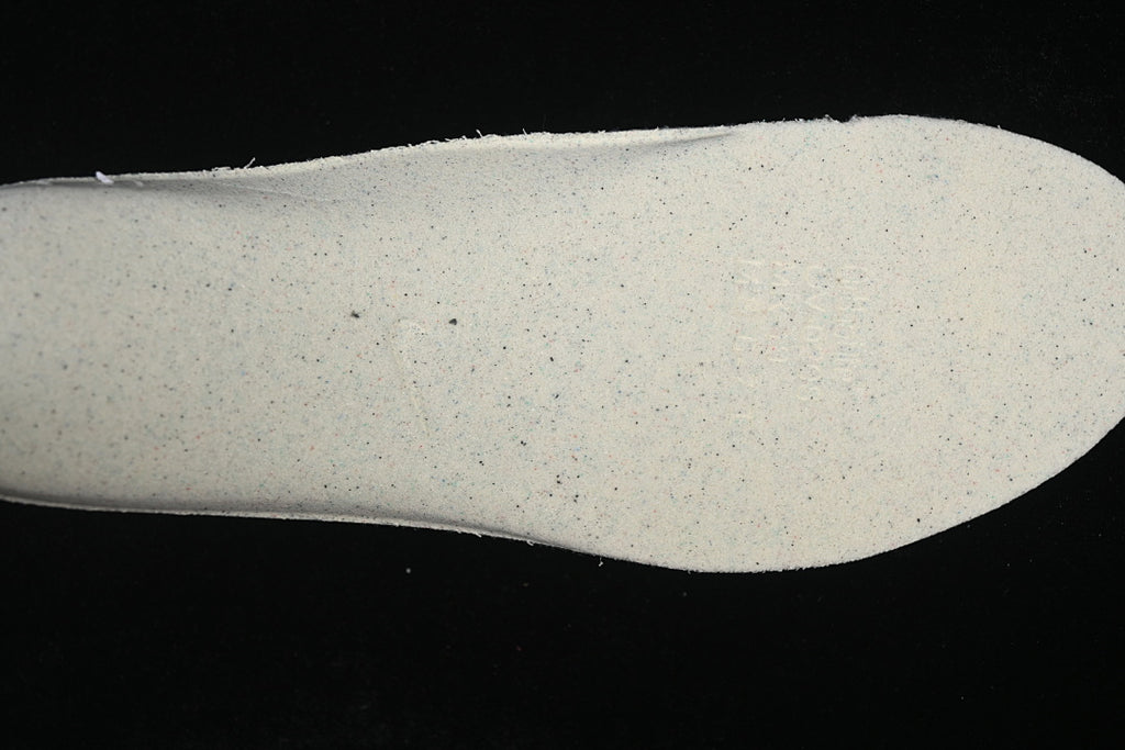 Close-up of a light-colored shoe insert.