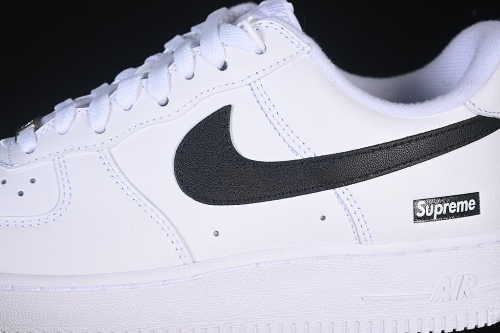 Close-up of black Swoosh and side box logo