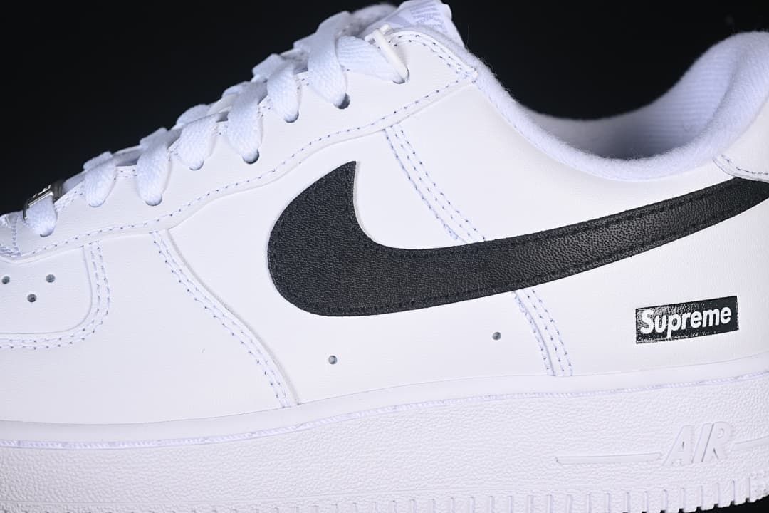 Close-up of black Swoosh and side box logo