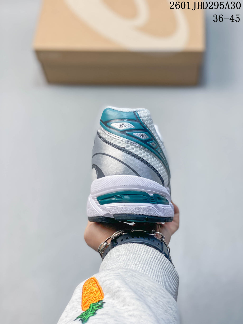 Rear view of the sneaker with teal heel accents