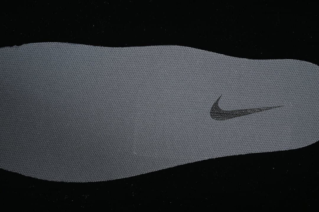Close-up of the grey footbed with a Swoosh logo