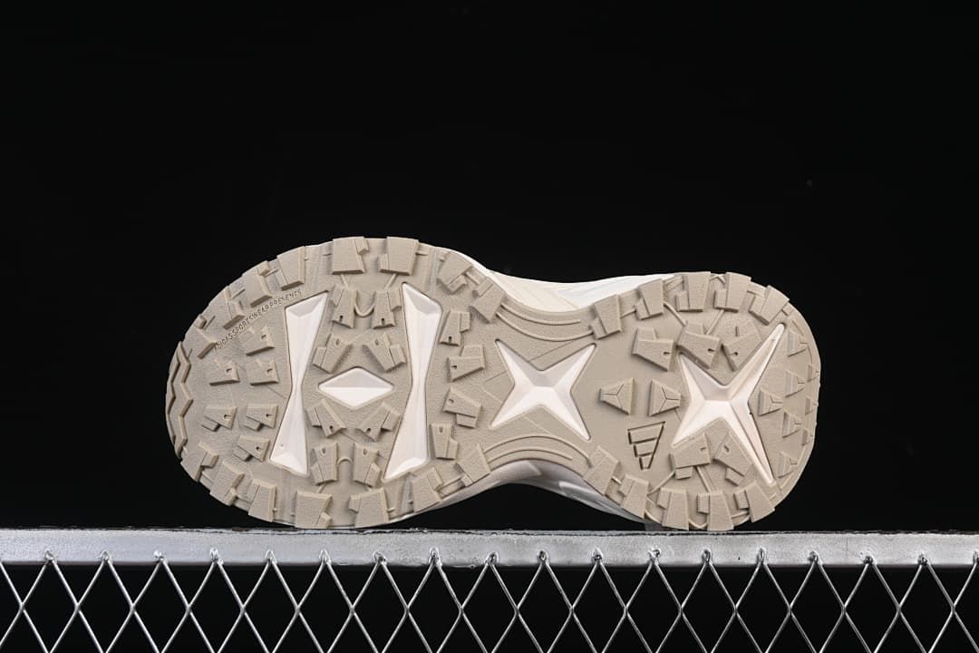 Underside view showing the patterned lug outsole.