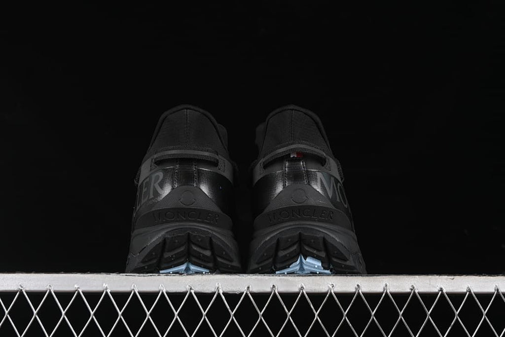 Rear view of the pair showing the heels and outsole tread