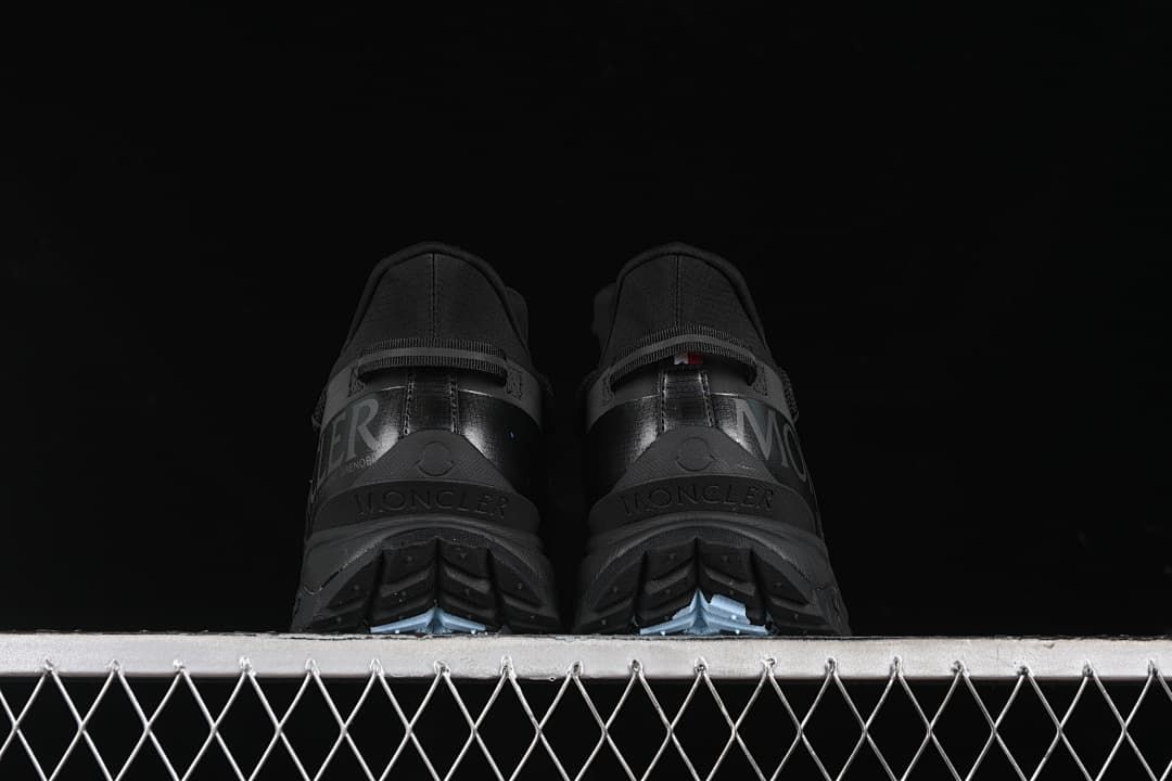 Rear view of the pair showing the heels and outsole tread