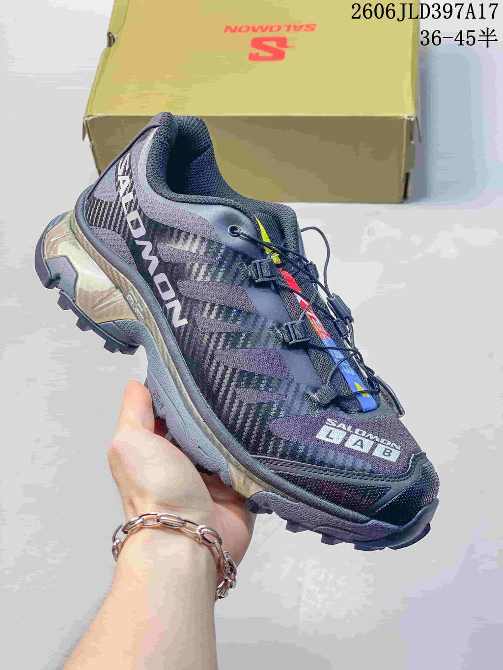 Angled side view of a Salomon XT-4 OG sneaker showing its patterned upper and lugged sole