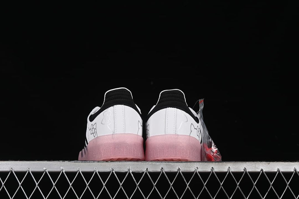 Rear view of the pair showing black heel accents and pink soles.
