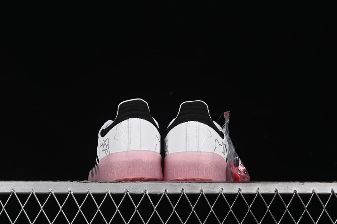 Rear view of the pair showing black heel accents and pink soles.