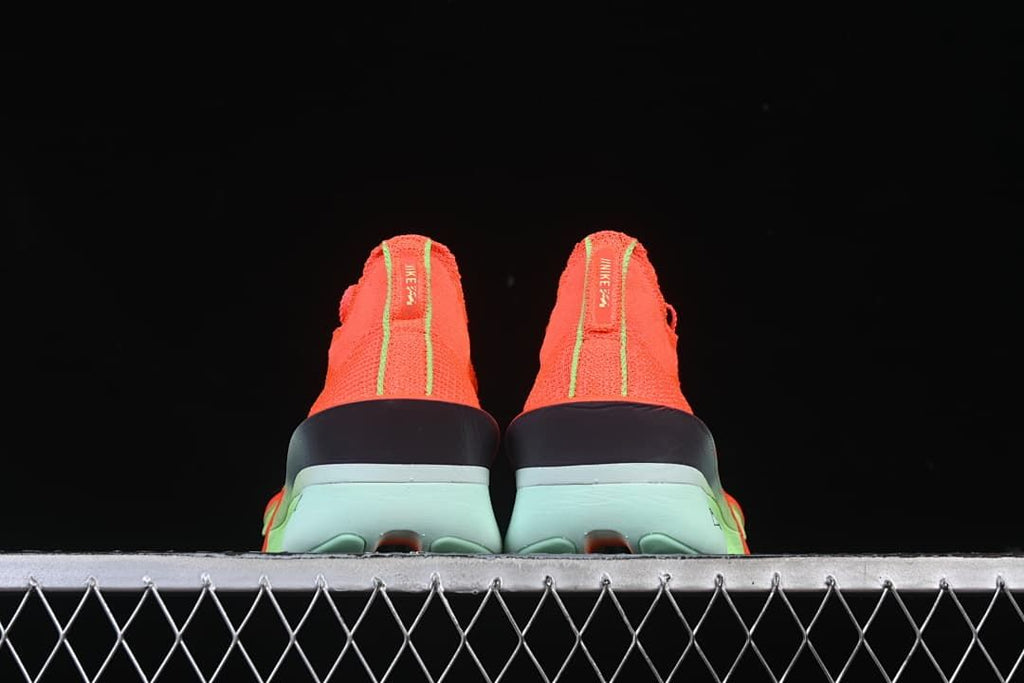 Rear view of the pair highlighting heel details and pale mint soles.