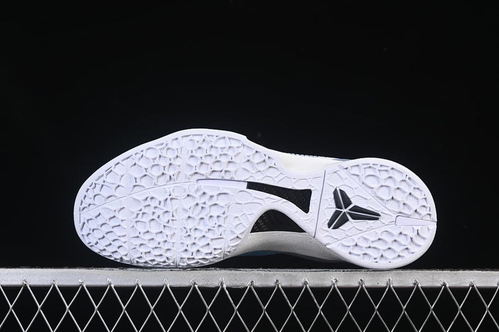 Underside view showing the patterned outsole and Kobe logo