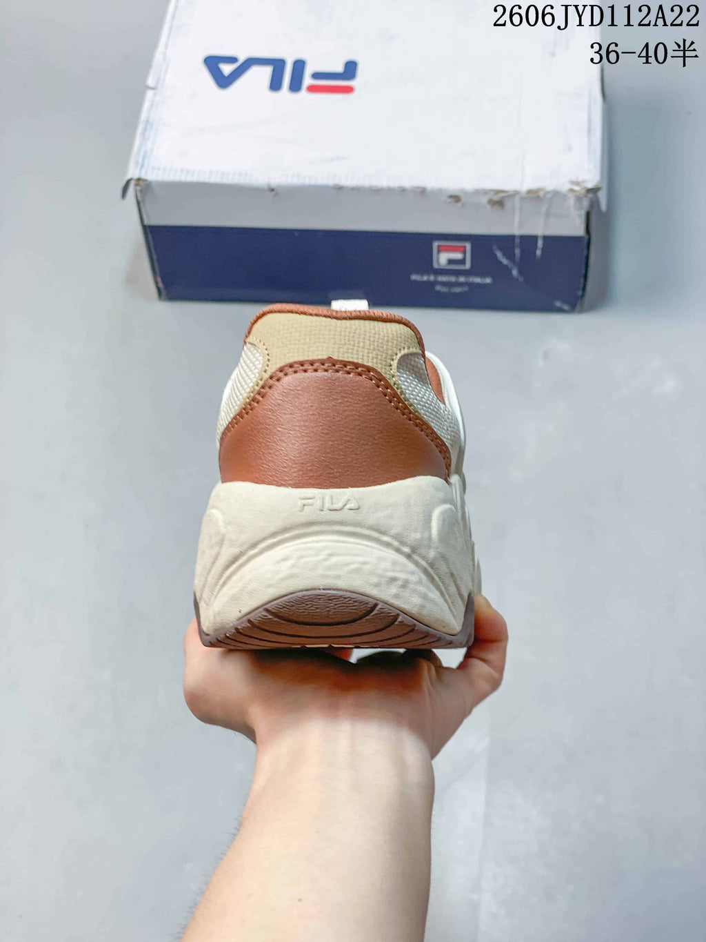 Rear view showing the cream sole and rust-colored heel accent
