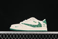 Side view of a cream and green low-top sneaker with a patterned green side panel