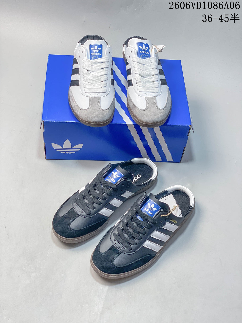 White and gray and dark gray and navy colorways of Samba-style lace-up sneakers.