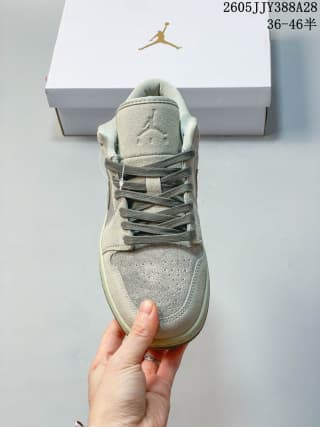 Front view showing the perforated toe and laces of the sneaker.