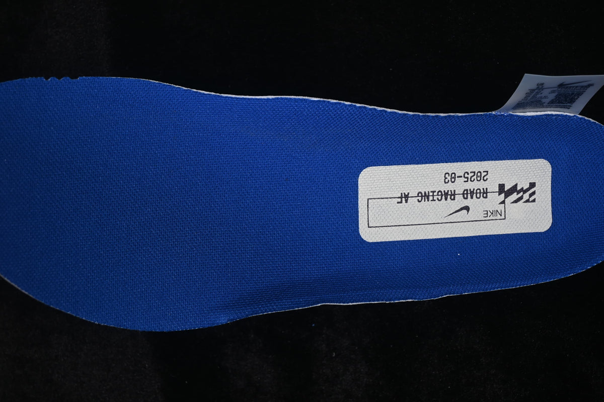 Blue insole with a printed road-running graphic.