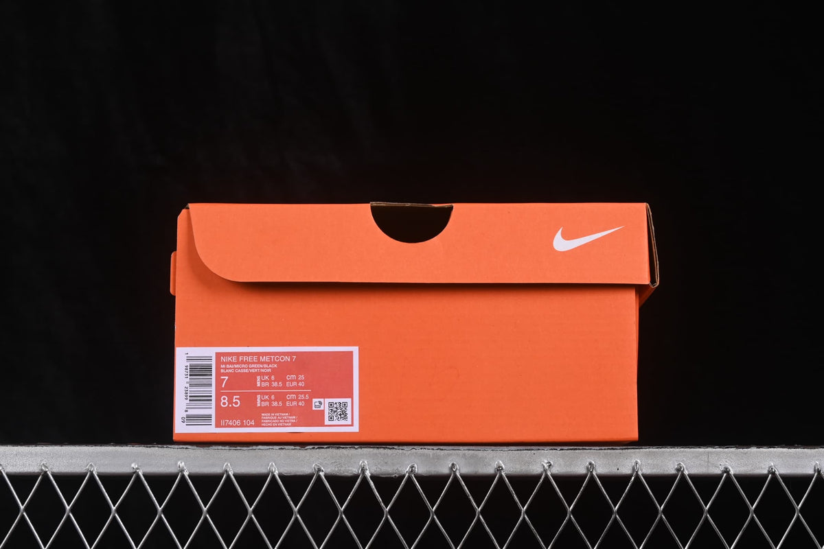 Orange Nike shoe box showing a Nike Free Metcon 7 label with style code II7406-104 and size information.
