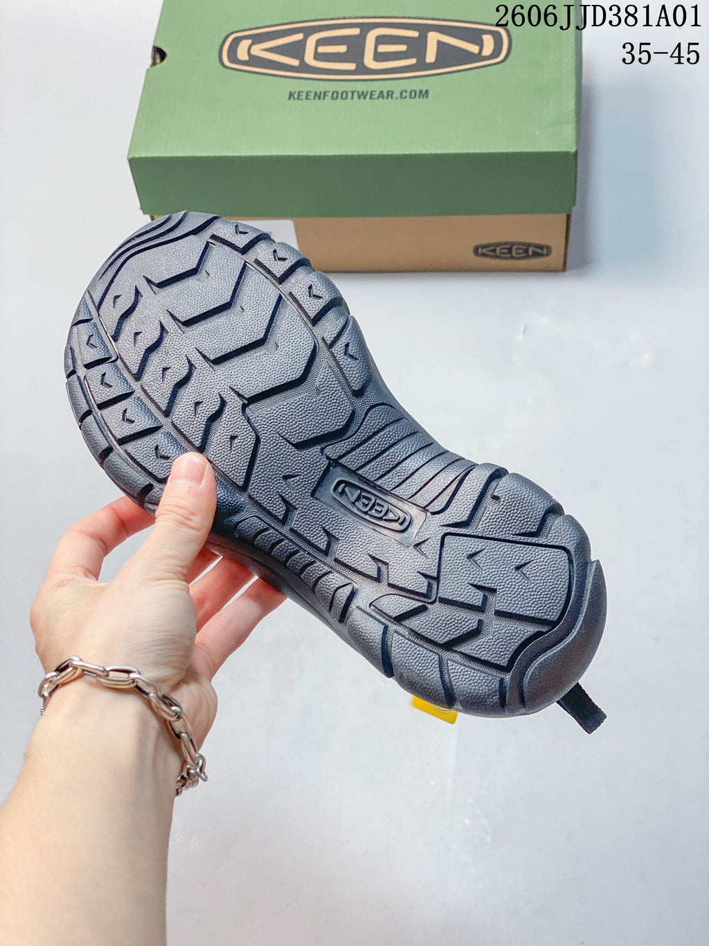 Close view of the sandal outsole with a patterned tread and a KEEN mark.